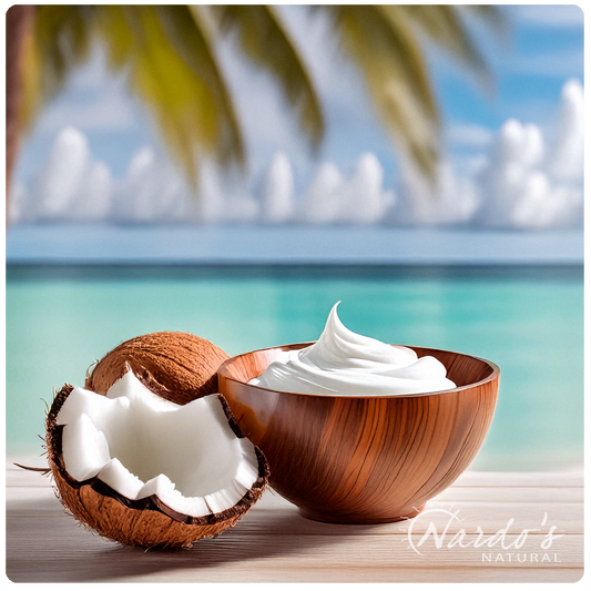 Half a coconut shell with cream inside on a beach 