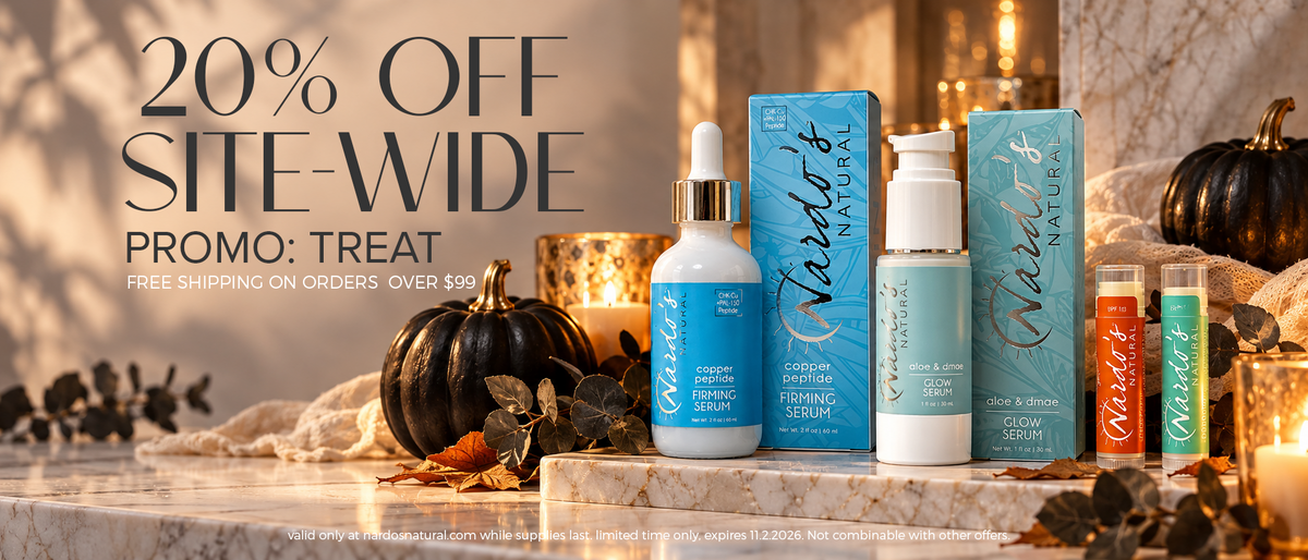 Halloween theme with pumpkins on a marble counter and nardo's natural skincare bottes, text reading 20% off site wide promo code TREAT
